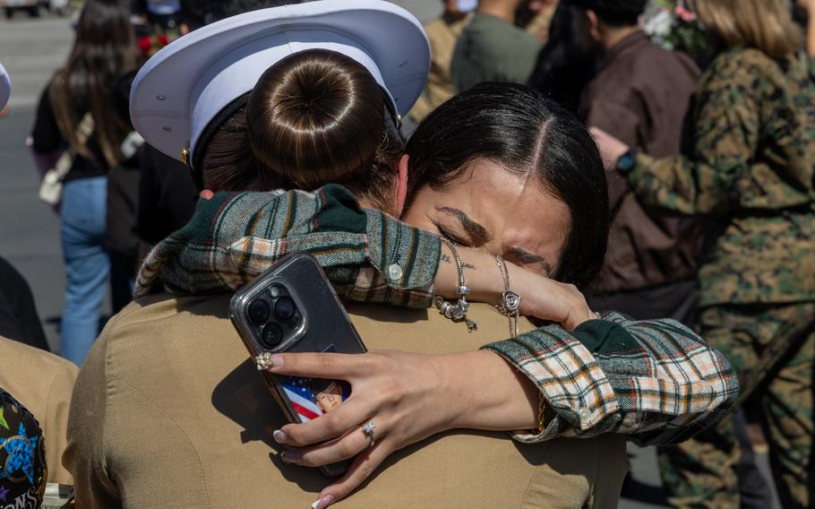 A new U.S. Marine is greeted with a hug