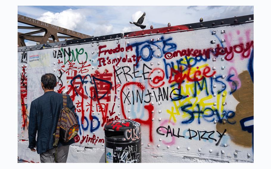 Graffiti reading "Free Xinjiang" is written on an area of wall that had been graffitied with Chinese Communist Party ideology, on Aug. 7, 2023, in Brick Lane, London. The graffiti refers to a set of "Core Socialist Values" derived from Chinese Socialism, promoted by the Chinese government over the last decade. 