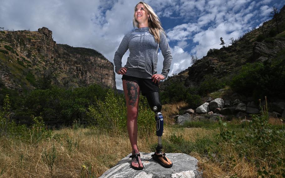 Former Marine Corps Sgt. Kirstie Ennis poses for a portrait at the trail head of Grizzly Creek trail in Glenwood Springs, Colo., on July 1, 2024. 