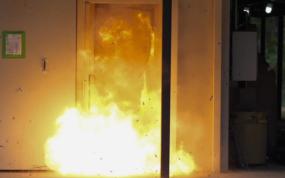 A door being blasted open.