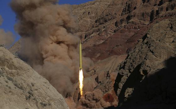 FILE - A Qadr H long-range ballistic surface-to-surface missile is fired by Iran's Revolutionary Guard during a maneuver in an undisclosed location in Iran, on March 9, 2016. (AP Photo/Omid Vahabzadeh, File)