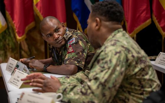 Kenyan army Lt. Col. Moses Mdzomba speaks with a U.S. Navy sailor Sept. 16, 2024, during a U.S. Army Southern European Task Force, Africa medical training planning session in Vicenza, Italy.