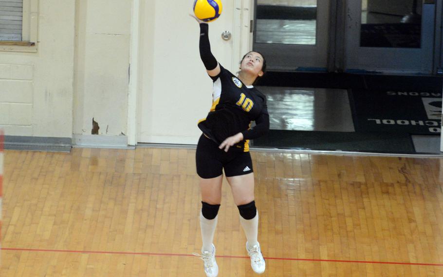 Kadena's Christina Kehe jump serves during Tuesday's Okinawa girls volleyball match. Kehe seerved nine aces and had 28 assists as the Panthers beat host Kubasaki in five sets.