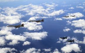 Two U.S. B-1B Lancers are escorted by South Korean 15K Slam Eagles and Japan Air Self-Defense Force Mitsubishi F-2s in airspace between South Korea and Japan, Jan. 15, 2025.