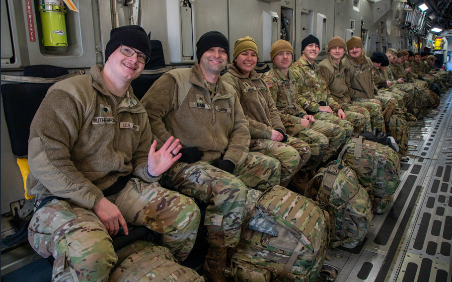 Soldiers and airmen with the Tennessee National Guard board a C-17 Globemaster III