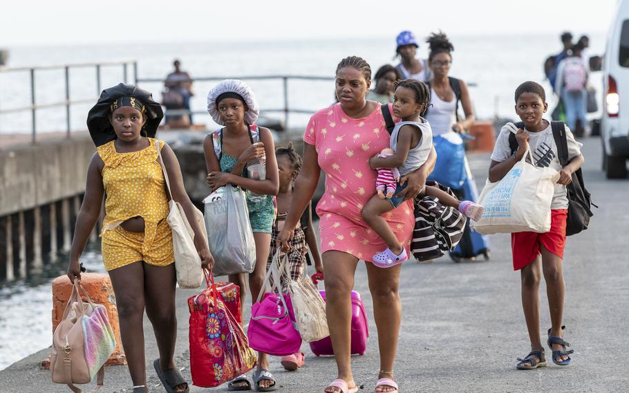 Evacuees from Union Island arrive in Kingstown, St. Vincent and the Grenadines, Tuesday, July 2, 2024. The island, in the Grenadines archipelago, was hit by Hurricane Beryl. 