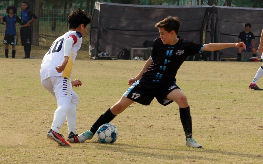 Aiden Machmer tries to steal the ball.