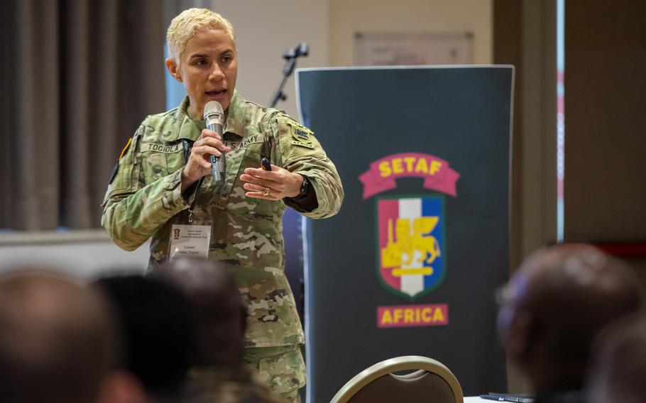 U.S. Army Col. Kelley Togiola, global health engagements chief for Southern European Task Force, Africa, speaks to a gathering in Vicenza, Italy, on Sept.16, 2024. 