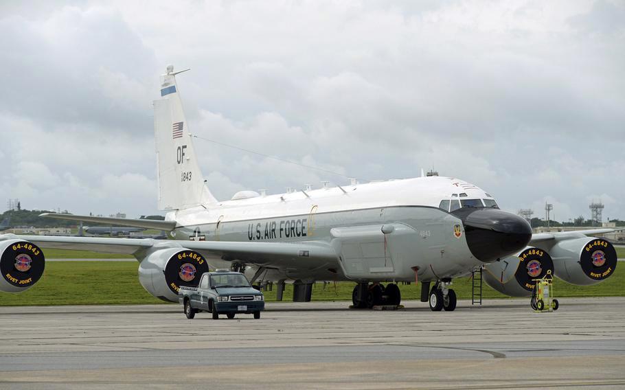 An Air Force RC-135V/W Rivet Joint reconnaissance aircraft sits near the flight line at Kadena Air Base, Okinawa, April 21, 2023.