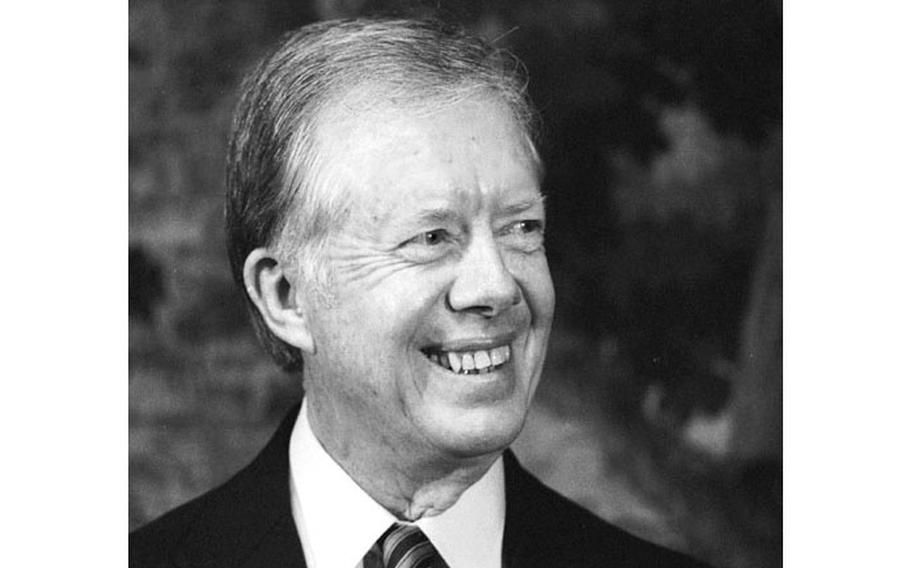 Jimmy Carter flashes a smile.