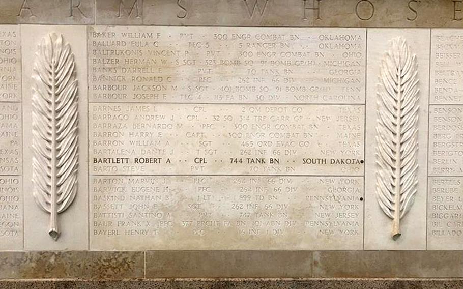 American Battle Monuments Commission staff placed a bronze rosette next to the name of U.S. Army Cpl. Robert A. Bartlett on the Wall of the Missing on July 24, 2024, at the Normandy American Cemetery in Colleville-sur-Mer, France.