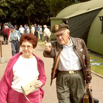 William "Buzz" Fitzroy explains to Lorraine McDaniel the layout of the former airfield at Thorpe Abbots, England. Fitzroy and about 20 other veterans of the 100th Bomb Group visited the site of their old base. 