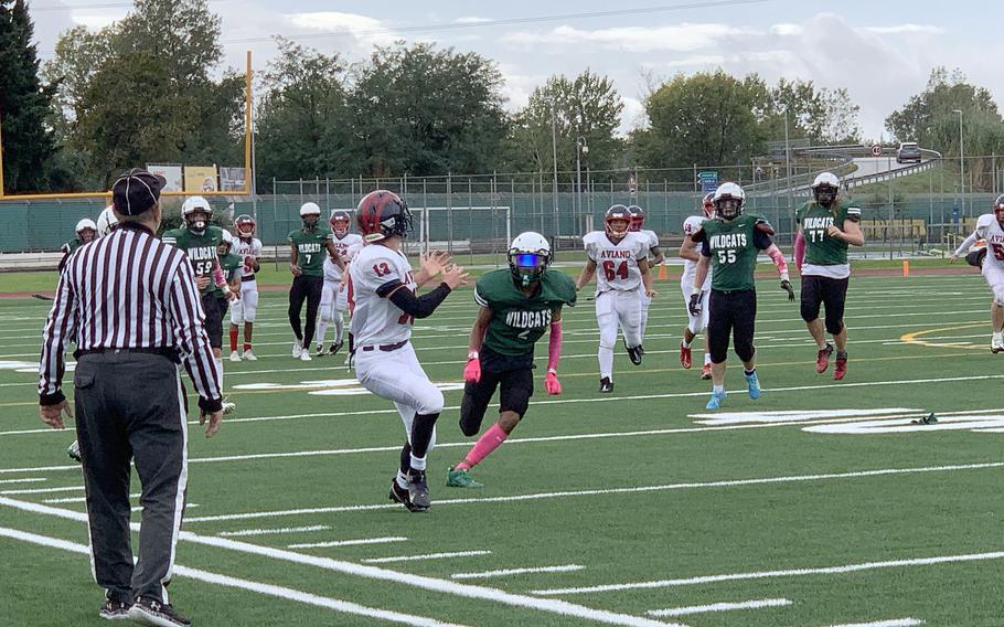 Saints wide receiver Colin North looks to catch a pass during Saturday's DODEA European Division II championship game at Naples. North caught the pass for a touchdown, which was called back on a penalty. 