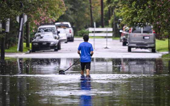 A man walks on a flooded street due to Tropical Storm Debby on Aug. 6, 2024, in Charleston, South Carolina. (Miguel J. Rodriguez Carrillo/Getty Images/TNS)