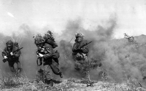 50 miles north of Seoul, South Korea, Oct. 1959: Republic of Korea First Army infantrymen, gasmasks on and bayonets at the ready, break through a simulated poison gas cloud. 
The exercise was part of Operation Killing Zone, the largest military field exercise since the founding of the First Republic of Korea Army in 1948. The exercise, deploying some 50,000 troops and held 50 miles north of Seoul was a test of combat effectiveness during a chemical, biological and radiological war.

Check out additional photos of the exercise and read the 1959 article here.

Looking for additional Stars and Stripes’ historic coverage? Subscribe to Stars and Stripes’ historic newspaper archive! We have digitized our 1948-1999 European and Pacific editions, as well as several of our WWII editions and made them available online through https://starsandstripes.newspaperarchive.com/

META TAGS: Korean Armistice; Republic of Korea; First ROK Army; Operation Killing Zone; exercise; multi-national exercise; 4th Missile Command; Cold War