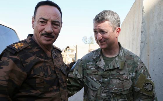 Dan Caine, right, then an Air Force brigadier general, meets with Maj. Gen. Najim in Mosul, Iraq, in 2018. MUST CREDIT: Keisha T. Brown/U.S. Army