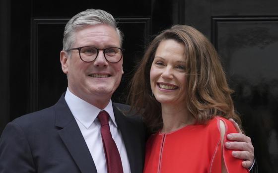 FILE - Britain's Labour Party Prime Minister Keir Starmer and his wife Victoria pose for the media on the doorstep of 10 Downing Street in London, Friday, July 5, 2024.After a few hours of sleep to shake off a night of celebration and an audience with the king, Keir Starmer will step through the front door of 10 Downing St. for the first time as prime minister on Friday. 