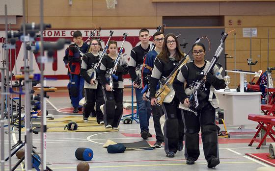 Shooters walk to the range during a marksmanship competition on Jan. 6, 2024, at Kaiserslautern High School in Kaiserslautern, Germany.