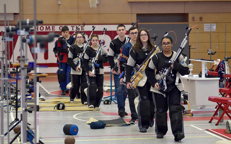 Shooters carry their air rifles to the competition last season.