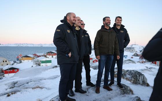 Donald Trump Jr., second right, poses for a picture upon his arrival in Nuuk, Greenland, Tuesday, Jan. 7, 2025. (Emil Stach/Ritzau Scanpix via AP)