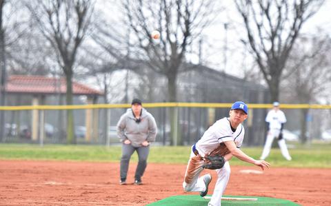 Hohenfels' Matheo Reyes watches his pitch fly toward home in the opening game of a doubleheader between the Tigers and the Aviano Saints on Saturday, March 22, 2025.

Kent Harris/Stars and Stripes