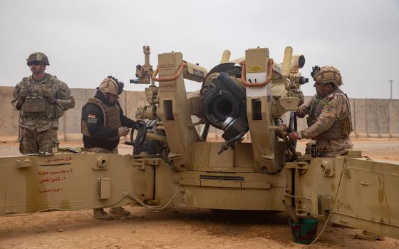 U.S., Iraqi, and French service members participate in an artillery live fire exercise at Al Asad Air Base, Iraq, Dec. 20, 2023. The live fire exercise, hosted by 2nd Platoon, Bravo Battery, 2-15 Field Artillery, 2nd Brigade Combat Team, 10th Mountain Division, was conducted to provide training to partner forces in alignment with the Combined Joint Task Force - Operation Inherent Resolve's mission in the enduring defeat of Daesh. (U.S. Army photo by Staff Sgt. Quince Lanford)