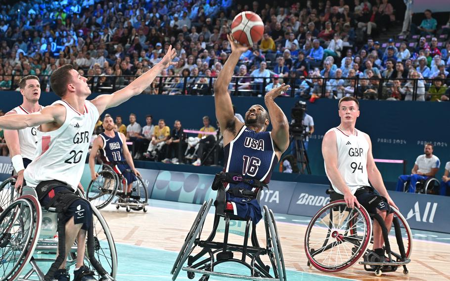 Trevan Jenifer of the United States shoots over Great Britain defender Peter Cusack in the wheelchair basketball championship game  at the 2024 Paris Paralympics, Sept. 7, 2024. The U.S. took the gold with a 73-69 win.