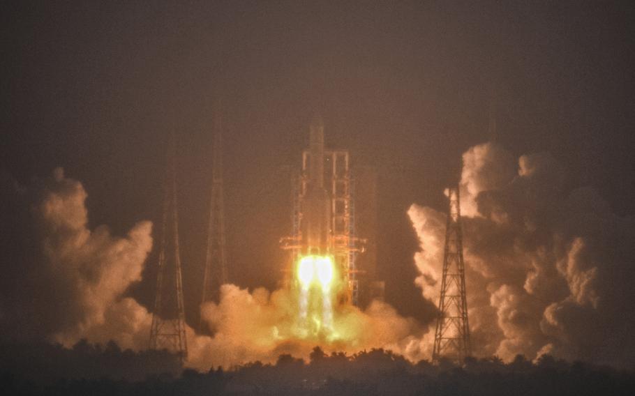 A Long March-5 rocket, carrying the Chang’e-6 spacecraft, blasts off from its launchpad at the Wenchang Space Launch Site in Wenchang, south China’s Hainan Province, on Friday, May 3, 2024. 