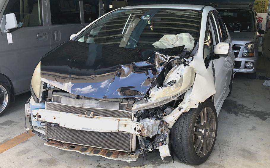A Honda Fit involved in a hit-and-run June 22, 2024, is impounded at a police lot in Okinawa city, June 25, 2024.