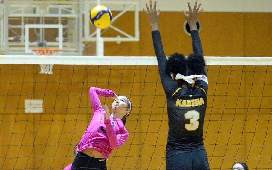 Yokota's Erica Haas spikes against Kadena's Liza Young during Thursday's American School In Japan YUJO tournament match. Yokota won in straight sets.