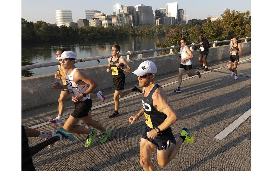 Group of runners running on the road