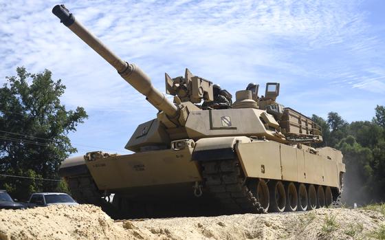 FILE - A M1A1 Abrams tank navigates on various types of matting systems