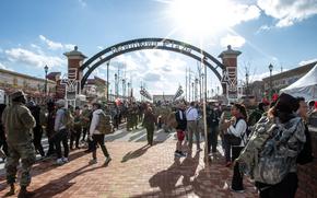 U.S. service members and their families gather at Camp Humphreys' downtown plaza after a ruck march in South Korea, Dec. 6, 2024. 