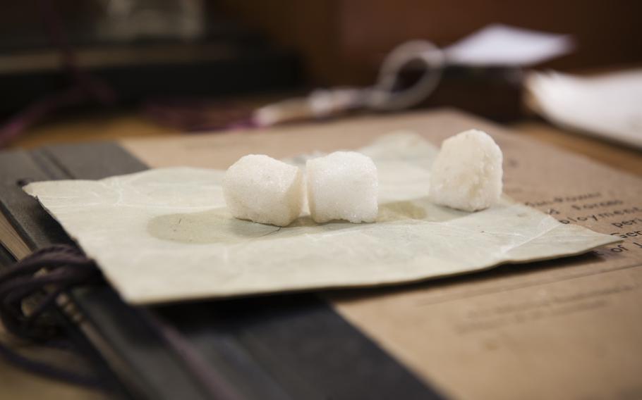 Sugar cubes on a desk.