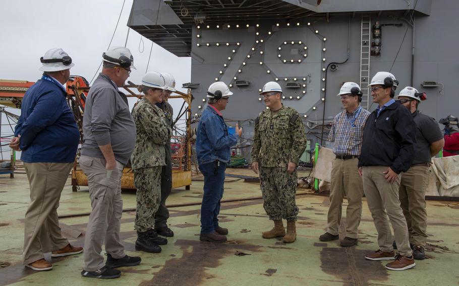 Rear Adm. Tom Anderson, acting commander of Naval Sea Systems Command, discusses the construction status of the aircraft carrier John F. Kennedy on Sept. 28, 2023, at Newport News, Va. To achieve its 30-year shipbuilding goal, the Navy will need a bigger budget than the service expects, according to a recent Congressional Budget Office report.