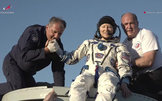 In this photo taken from video released by Roscosmos space corporation, rescue team members help NASA astronaut Tracy Dyson to leave the capsule shortly after the landing of the Russian Soyuz MS-25 space capsule carrying the NASA astronaut Tracy Dyson and the Roscosmos cosmonauts Oleg Kononenko and Nikolai Chub, south-east of the Kazakh town of Zhezkazgan, Kazakhstan, Monday, Sept. 23, 2024. (Roscosmos space corporation via AP)