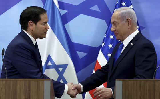 U.S. Secretary of State Marco Rubio, left, and Israeli Prime Minister Benjamin Netanyahu shake hands as they make joint statements to the press at the Prime Minister's office in Jerusalem, Israel, Sunday, Feb. 16, 2025. (Evelyn Hockstein/Pool Photo via AP)