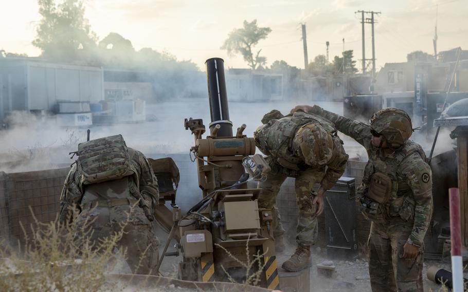 U.S. soldiers fire a mortar.