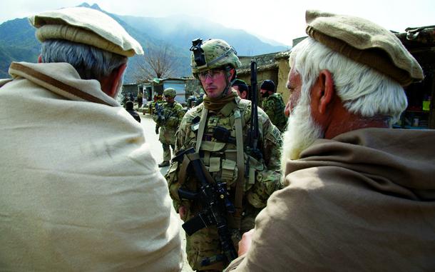 HED: Friend to Foe, 2012

Shegal district, Afghanistan, Feb. 22, 2012: First Lt. Andrew Ferrara, a 23-year-old platoon leader from Torrance, Calif., talks with locals during a patrol of the main bazaar in Shegal district, Kunar province.

Through meetings with insurgent leaders in the district, Ferrara and Capt. Michael Kolton, commander of Company B, 2nd Battalion, 27th Infantry Regiment, try to persuade them to defect and cooperate with them. "How do you reconcile someone that has a personal hatred against everything that you stand for?" Kolton said. It's a question they not only ask about the insurgents, but also of themselves having lost friends - and in Ferrara's case, his older brother - to insurgent attacks. 

Read the full story here: https://www.stripes.com/theaters/middle_east/foe-to-friend-gis-leery-about-working-with-taliban-defectors-who-wanted-them-dead-1.174518

META TAGS: Afghanistan; Operation Enduring Freedom; U.S. Army; Company B, 2nd Battalion, 27th Infantry Regiment;
