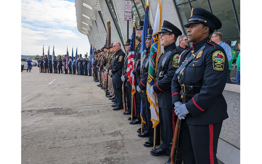 An Honor Guard greets 110 veterans from Honor Flight Chicago at Dulles International Airport outside Washington on Oct. 18, 2023.