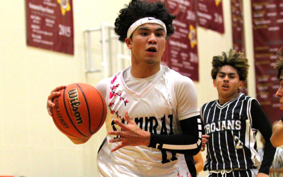 Kameron Ramos drives toward the basket.