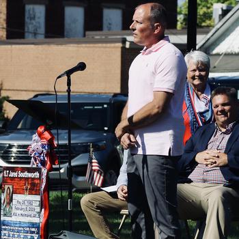 Sgt. 1st Class (ret.) Heath Clark speaks during a ceremony July 6, 2024, as a section of State Highway 133 through Oakland, Ill., was named the 1st Lt. Jared W. Southworth Highway. 