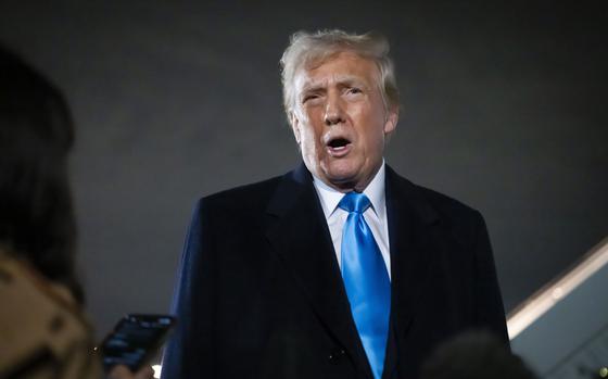 President Donald Trump speaks to reporters next to Air Force One after arriving back at Joint Base Andrews, Md., Sunday, Feb. 2, 2025. (AP Photo/Ben Curtis)