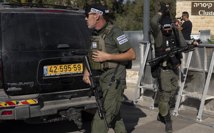 Israeli security forces secure a road near where Israel’s government says a drone launched toward Israeli Prime Minister Benjamin Netanyahu’s house in Caesarea, Israel Saturday, Oct. 19, 2024. 