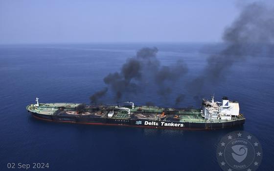 This photo released by the European Union's Operation Aspides naval force shows the Greek-flagged oil tanker Sounion burning in the Red Sea following a series of attacks by Yemen's Houthi rebels on Monday, Sept. 2, 2024. (European Union's Operation Aspides via AP)