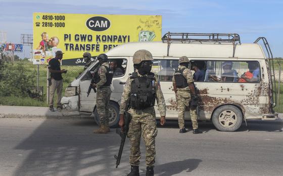 Police officers patrol near the Toussaint Louverture International Airport in Port-au-Prince, Haiti, Tuesday, Nov. 12, 2024. (AP Photo/Odelyn Joseph)