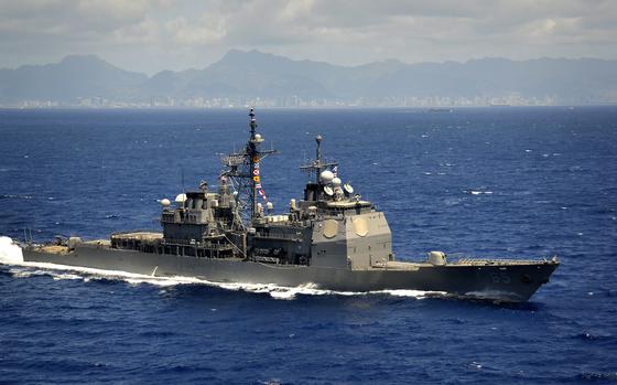 The Ticonderoga-class guided-missile cruiser USS Chosin (CG 65) conducts exercises off the coast of Hawaii following a departure from Joint Base Pearl Harbor-Hickam.