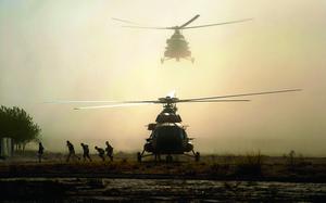 Kunduz, Afghanistan, Oct. 7, 2015: Men run from an Afghan air force Mi-17 helicopter as it lands at a military base outside of Kunduz city. Aircraft played a major role in shuttling reinforcements and supplies after Taliban forces seized the city and blocked roads.

Read Josh Smith's article on the aerial lifeline here. 
https://www.stripes.com/migration/afghan-aircraft-form-lifeline-to-besieged-cities-1.373263

META TAGS: Operation Freedom Sentinel; Afghanistan; Afghan Army; Wars on Terror