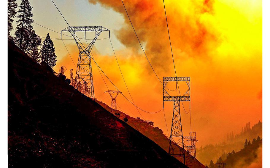 The Camp Fire burns near Pulga, Calif., in 2018. The blaze was linked to maintenance delays on PG&E power lines. 