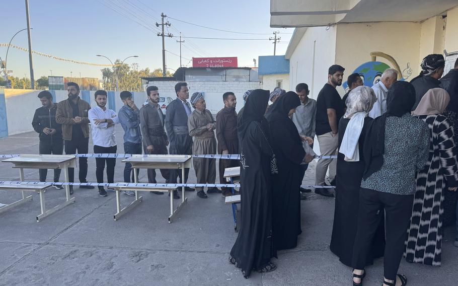 People line up to vote in Iraq.